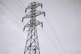 black electric tower under white sky