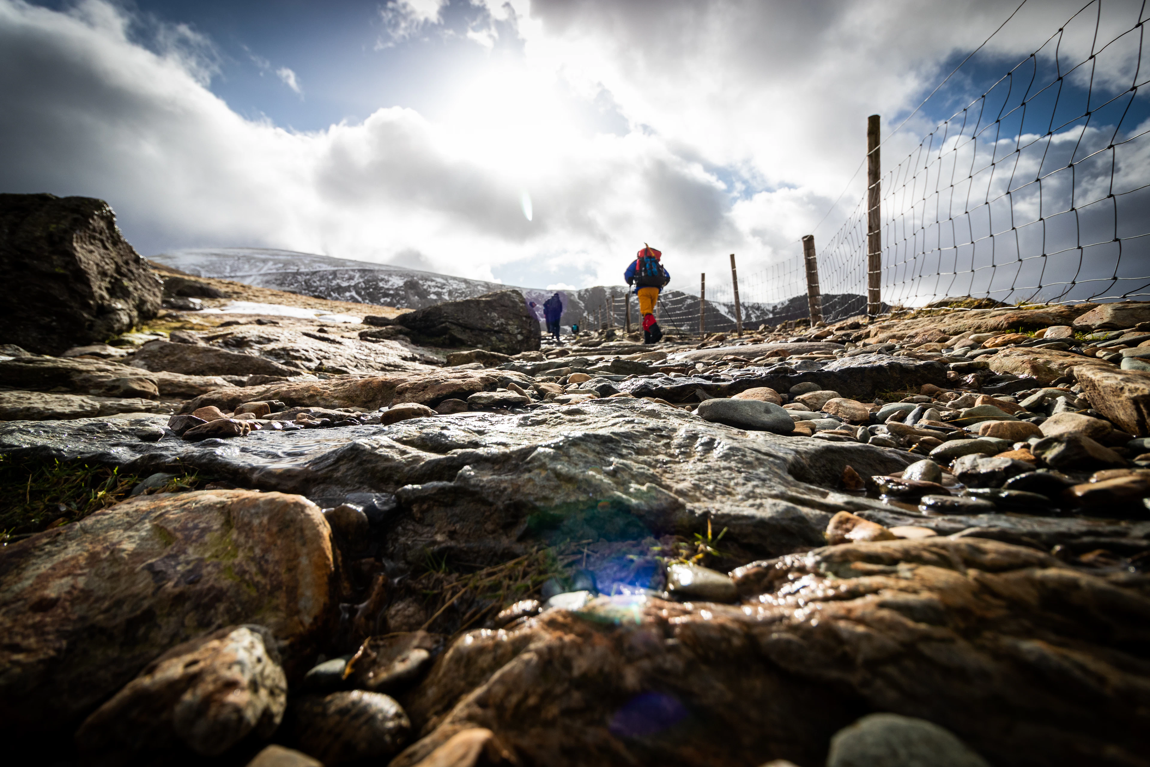 Two walkers on a rocky top in Snowdonia National Park