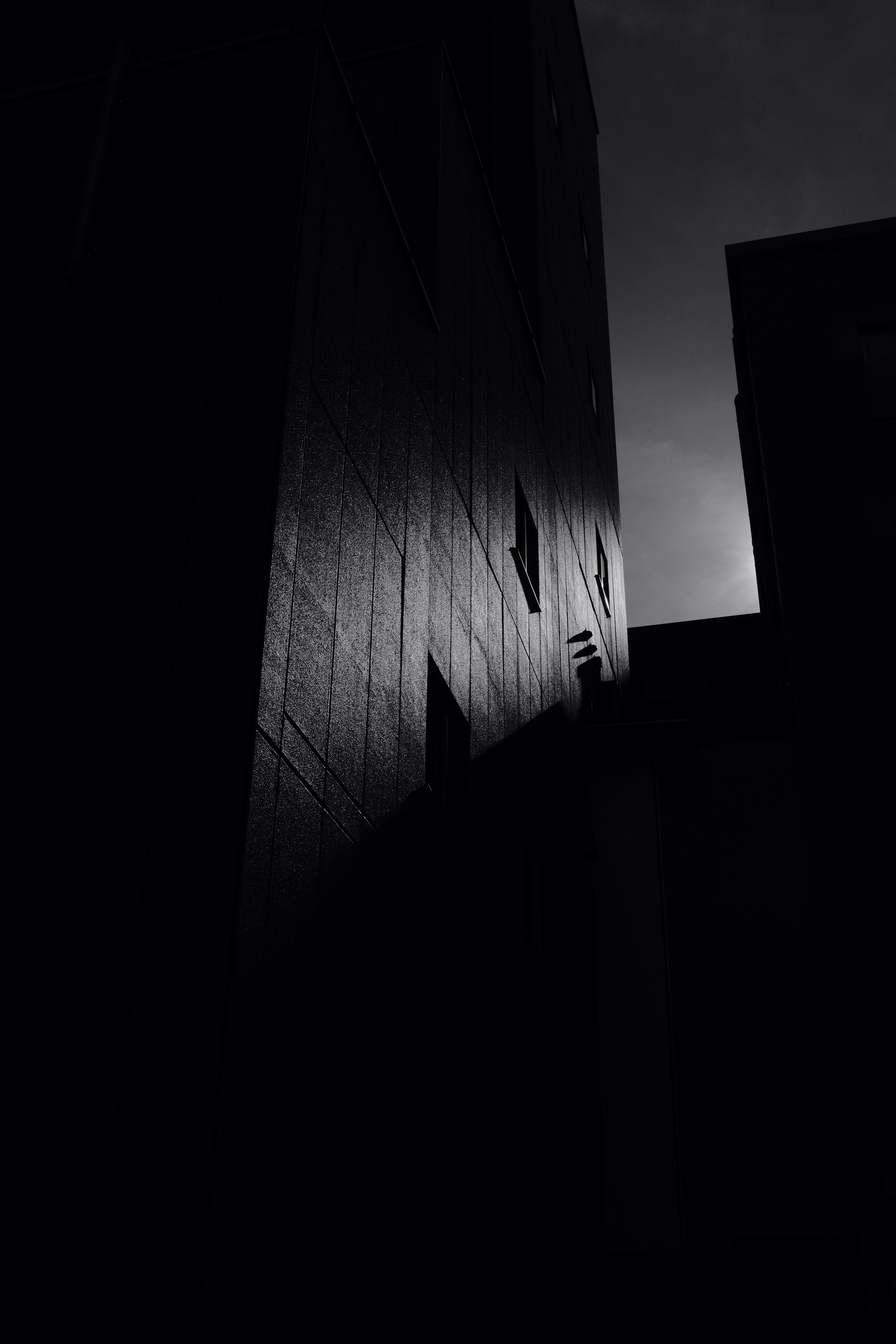 grayscale photo of high rise building