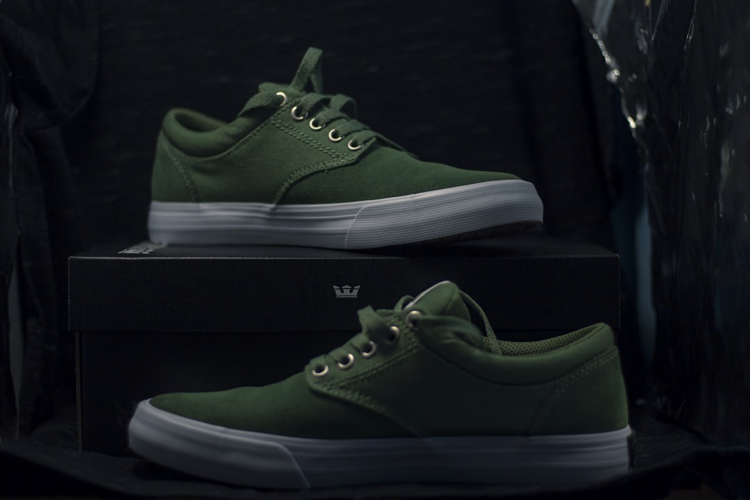 green and white nike low top sneakers,