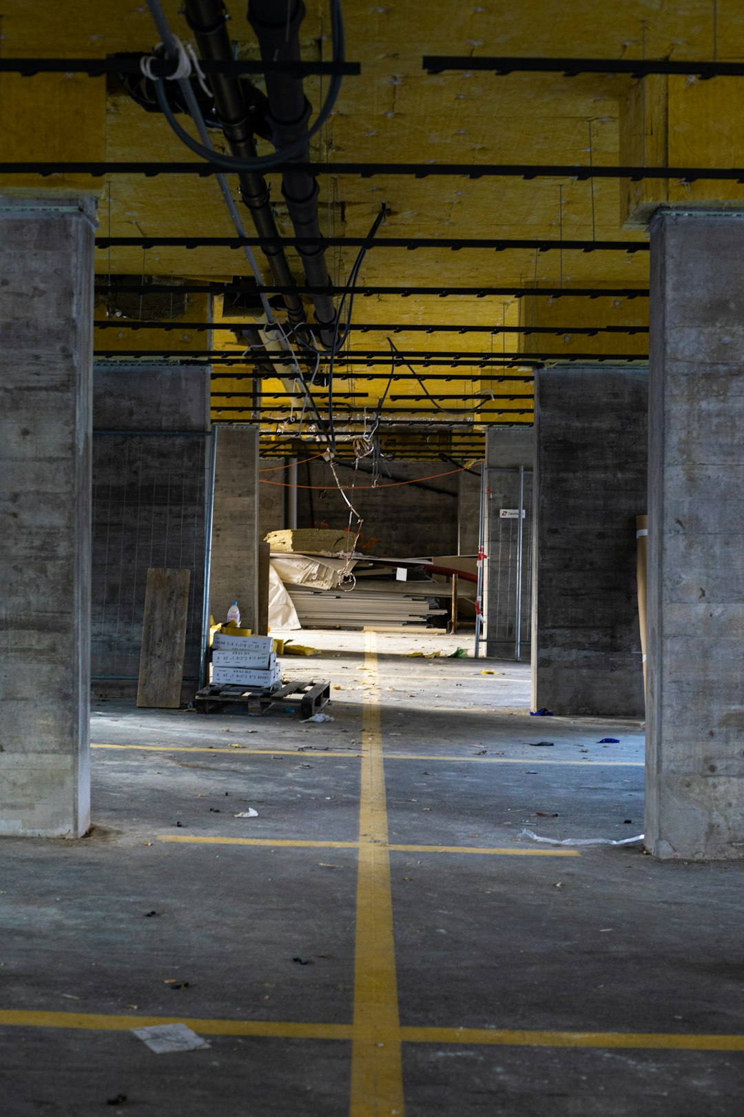 black car parked beside gray concrete building