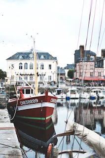 red and white boat on dock during daytime