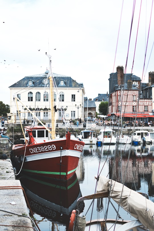 red and white boat on dock during daytime in Honfleur France