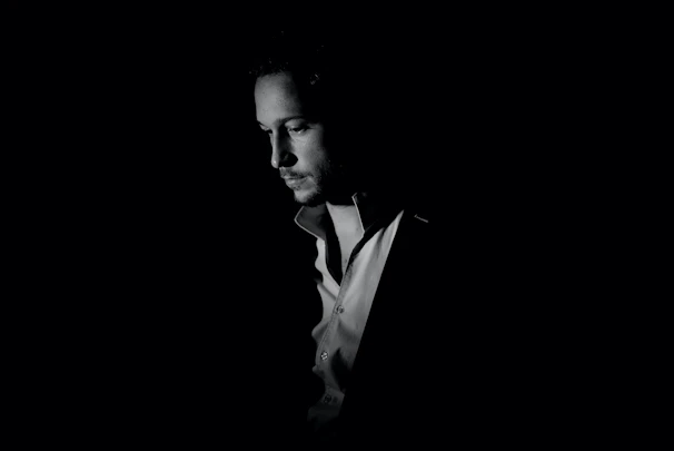 An artistic black and white portrait showing deep emotion.