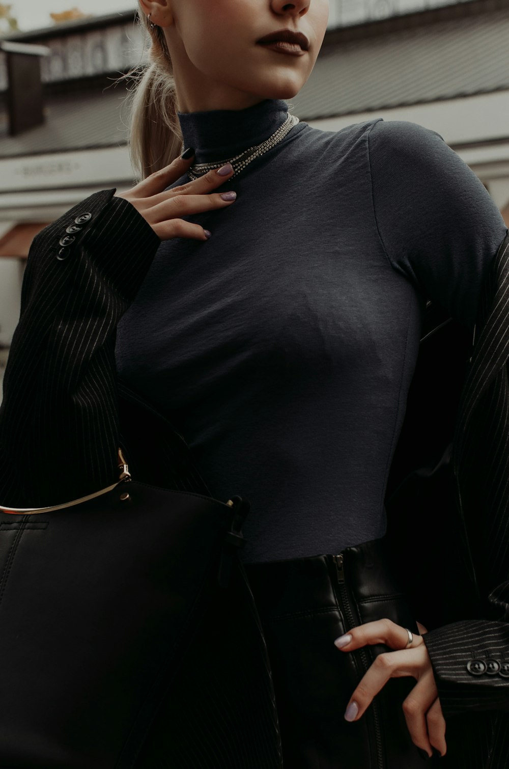 woman in black long sleeve shirt and black cardigan
