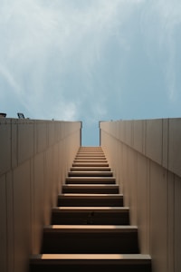 brown wooden bench on gray concrete floor