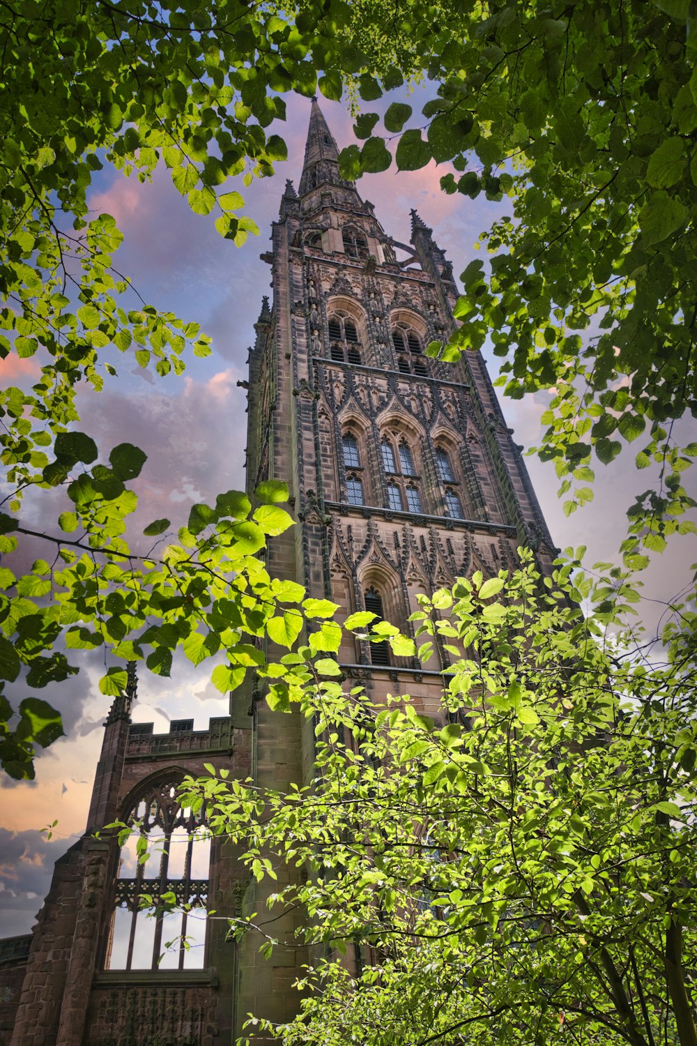 brown concrete church under cloudy sky