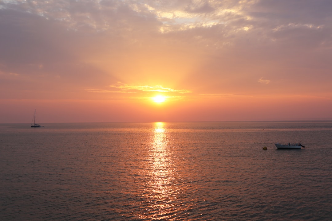 body of water during sunset