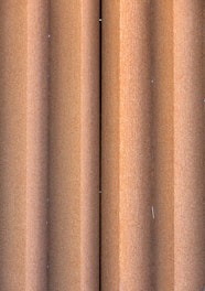 Close-up of stacked ship metal sheets with rust textures.