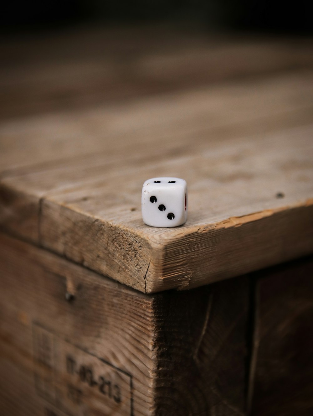 white dice on brown wooden table