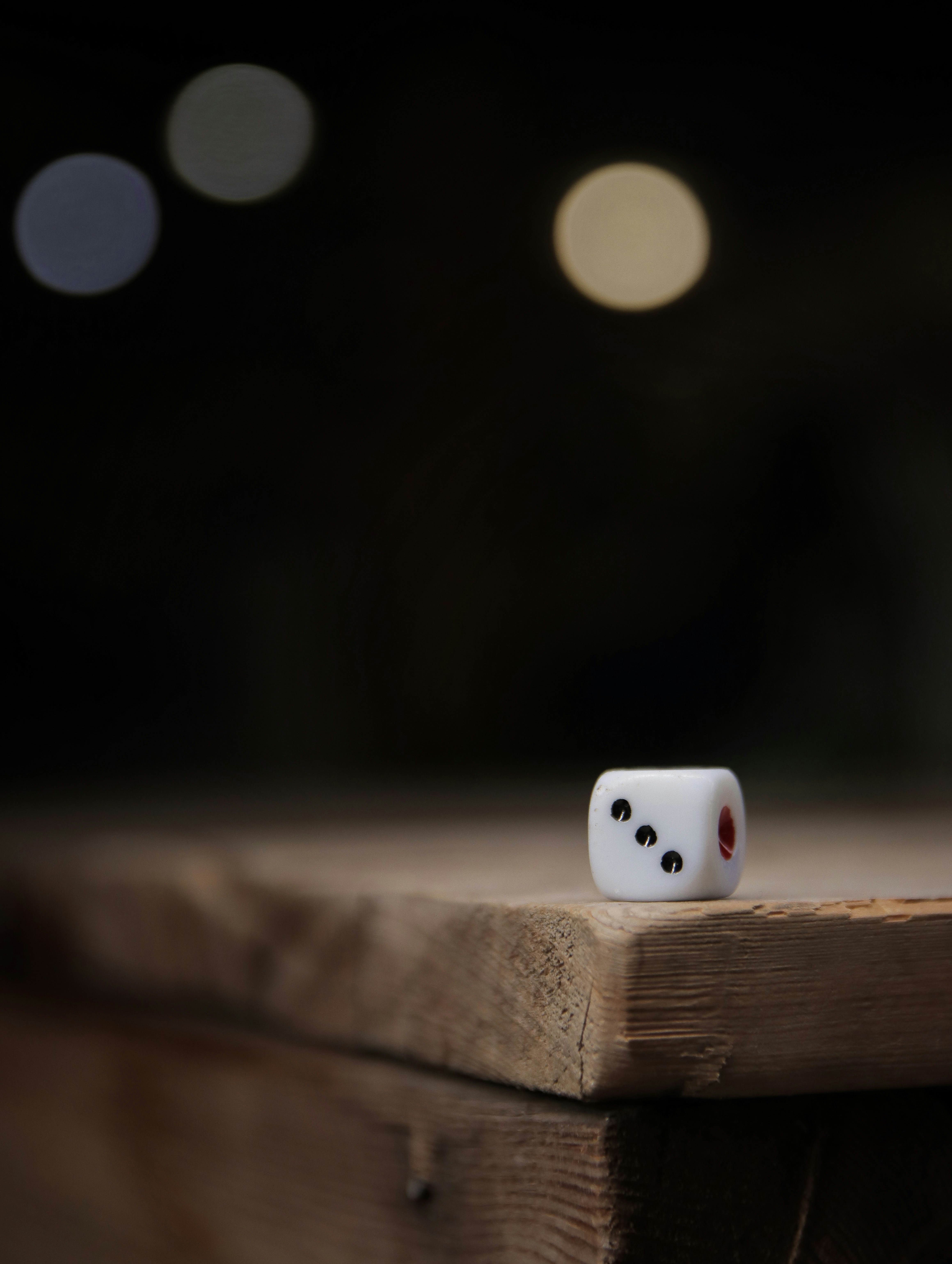 white dice on brown wooden surface