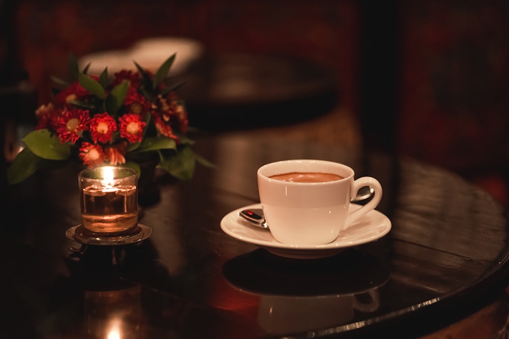 white ceramic cup on white ceramic saucer