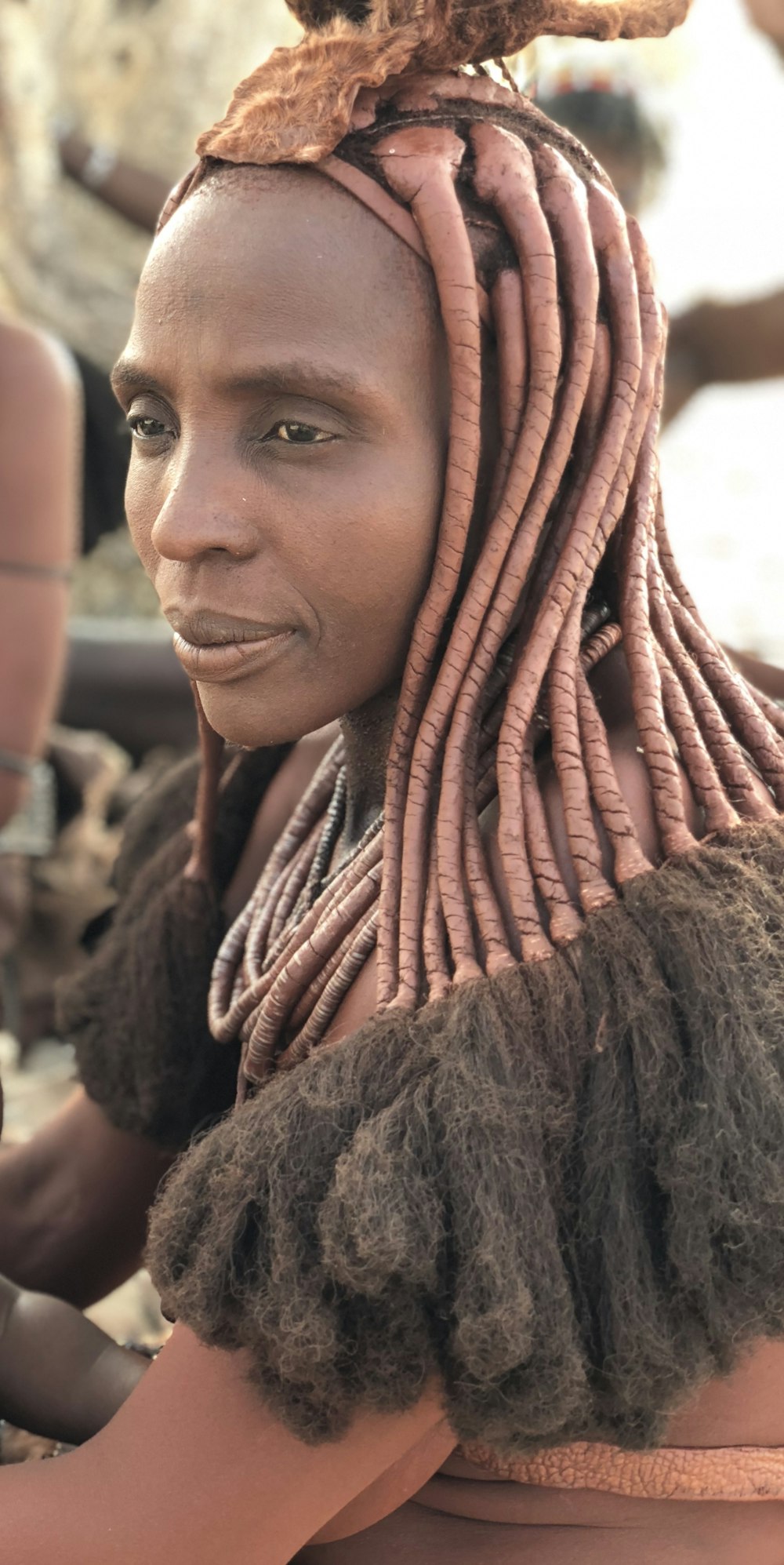 woman in brown hijab smiling