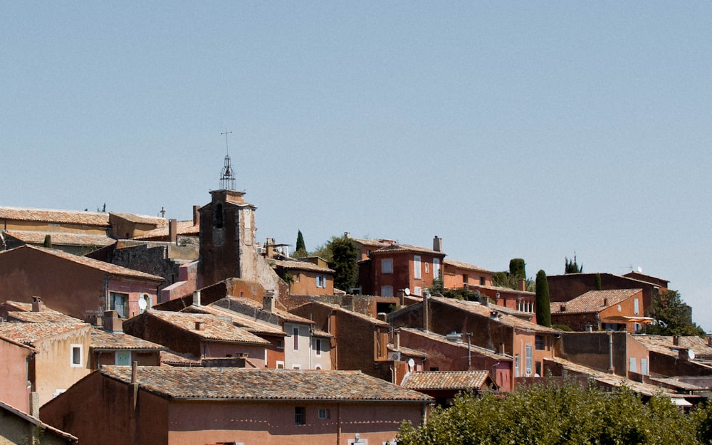 brown and white concrete houses under blue sky during daytime