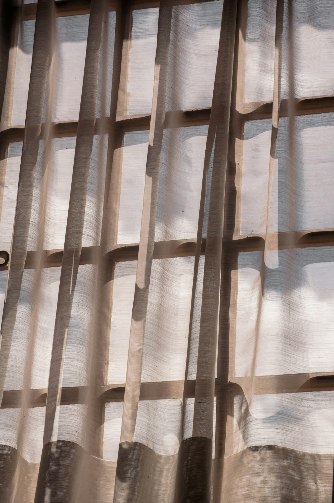 white and brown window curtain