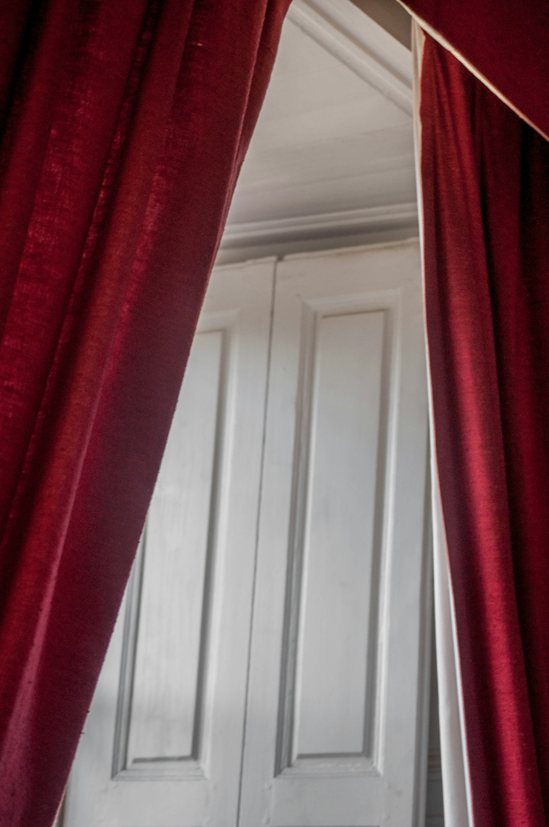 red and white window curtain