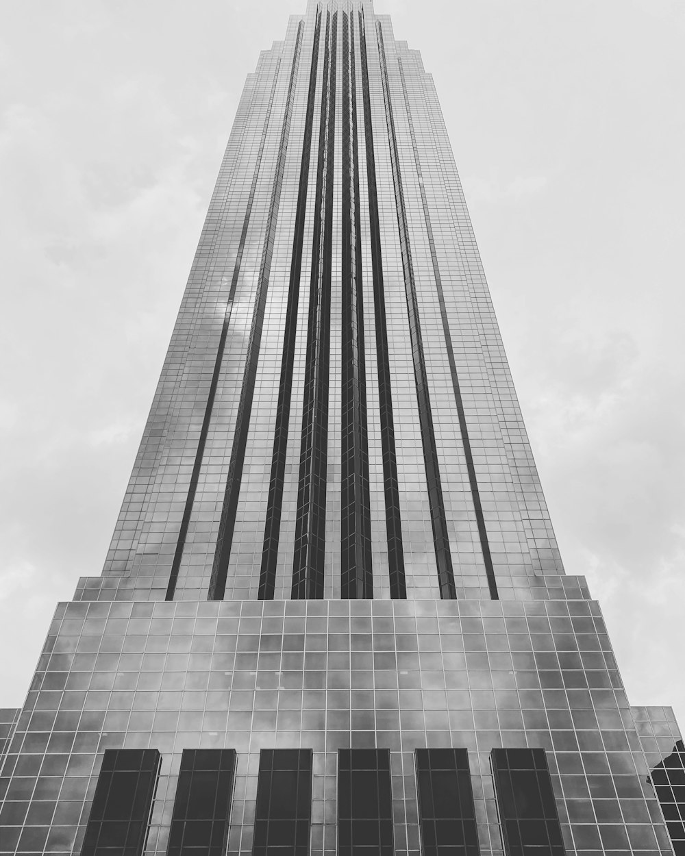 gray concrete building under white clouds during daytime