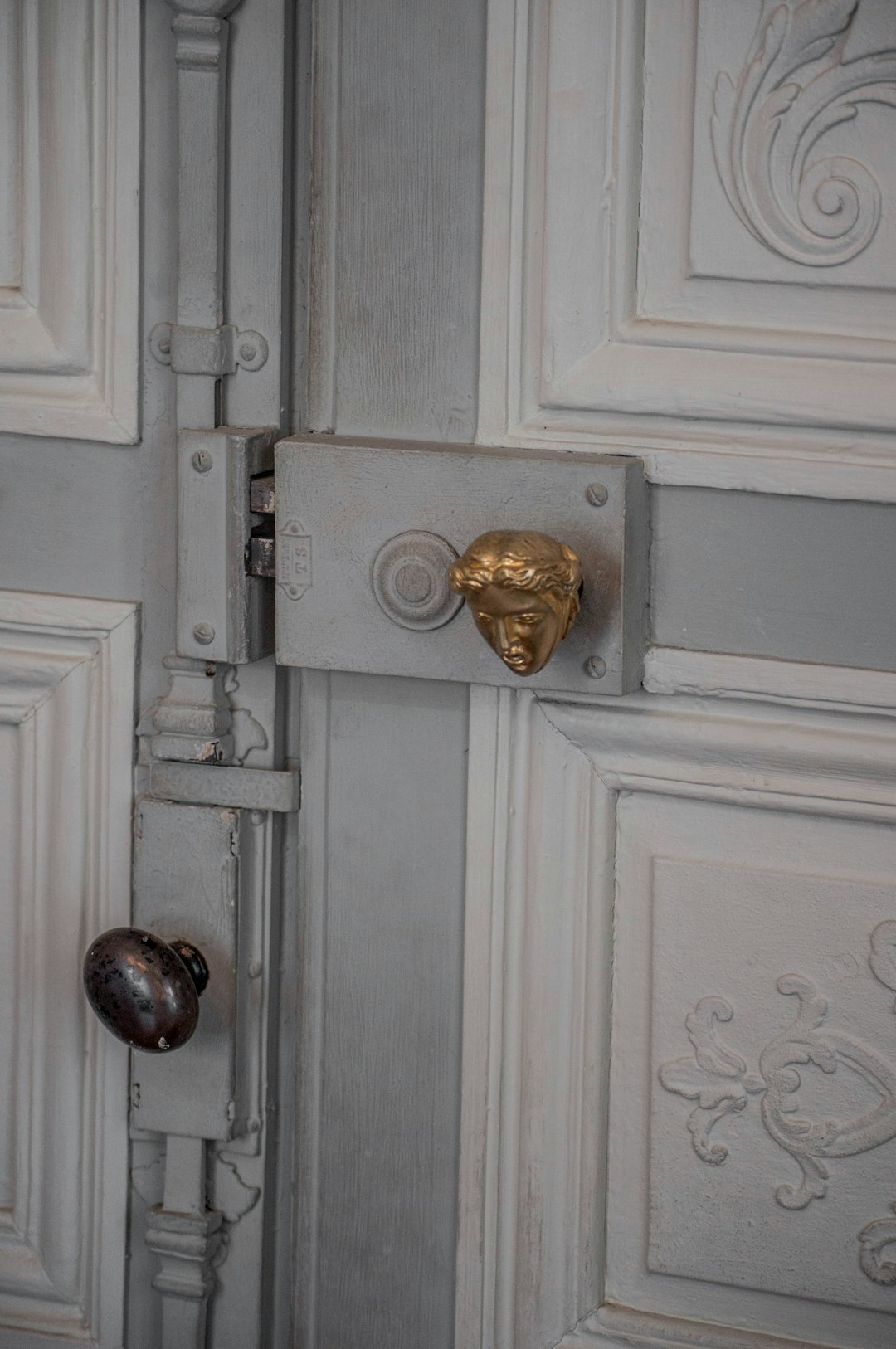 white wooden door with gold door knob