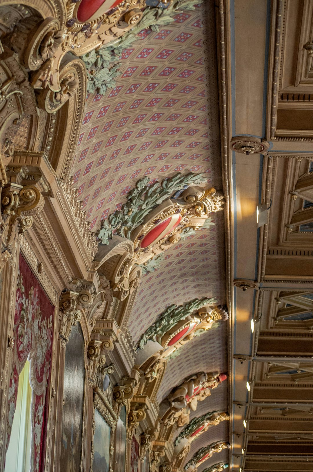 white and gold ceiling with paintings