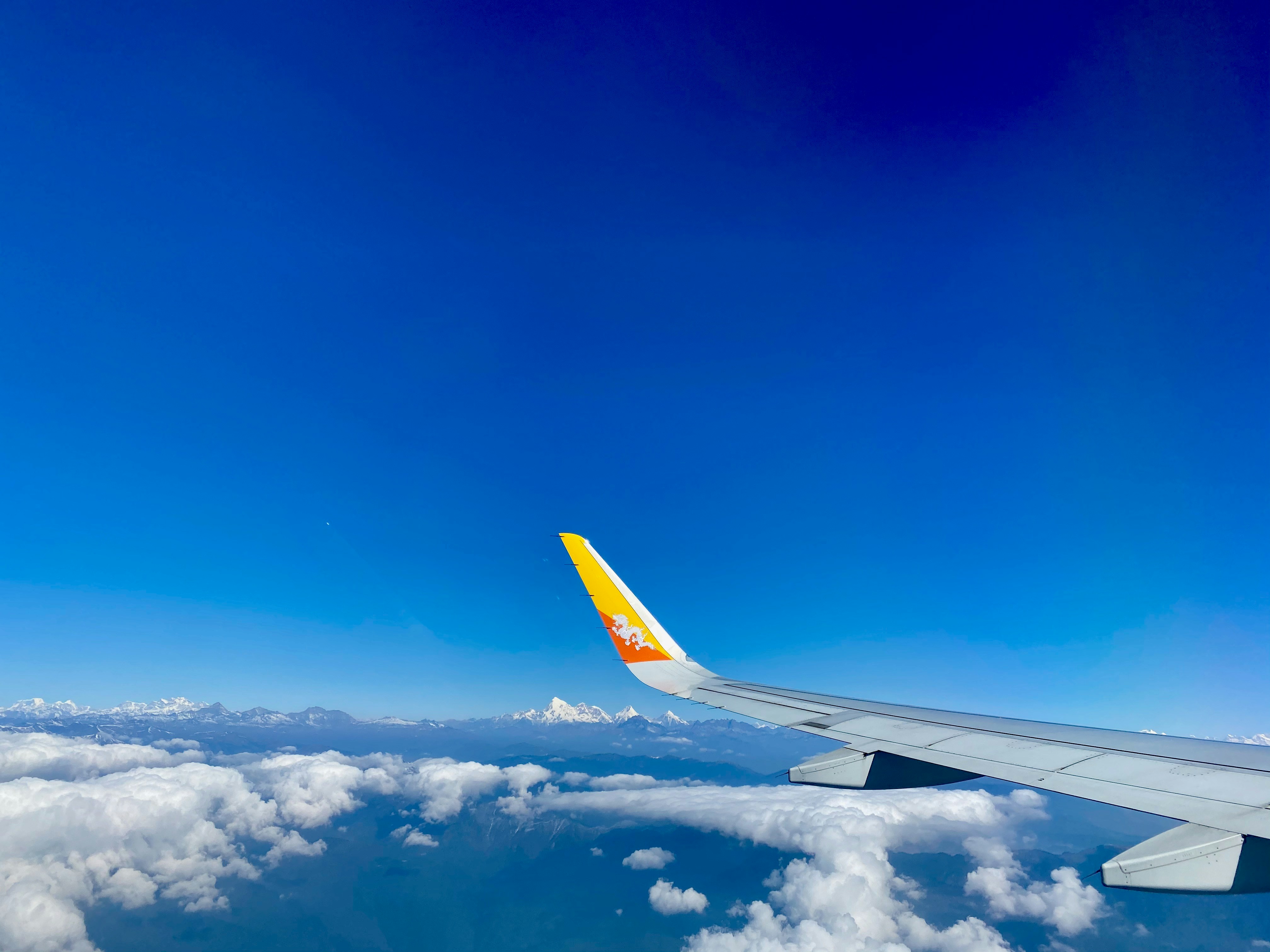 white clouds and blue sky during daytime, Himalayas in Bhutan. 2020.