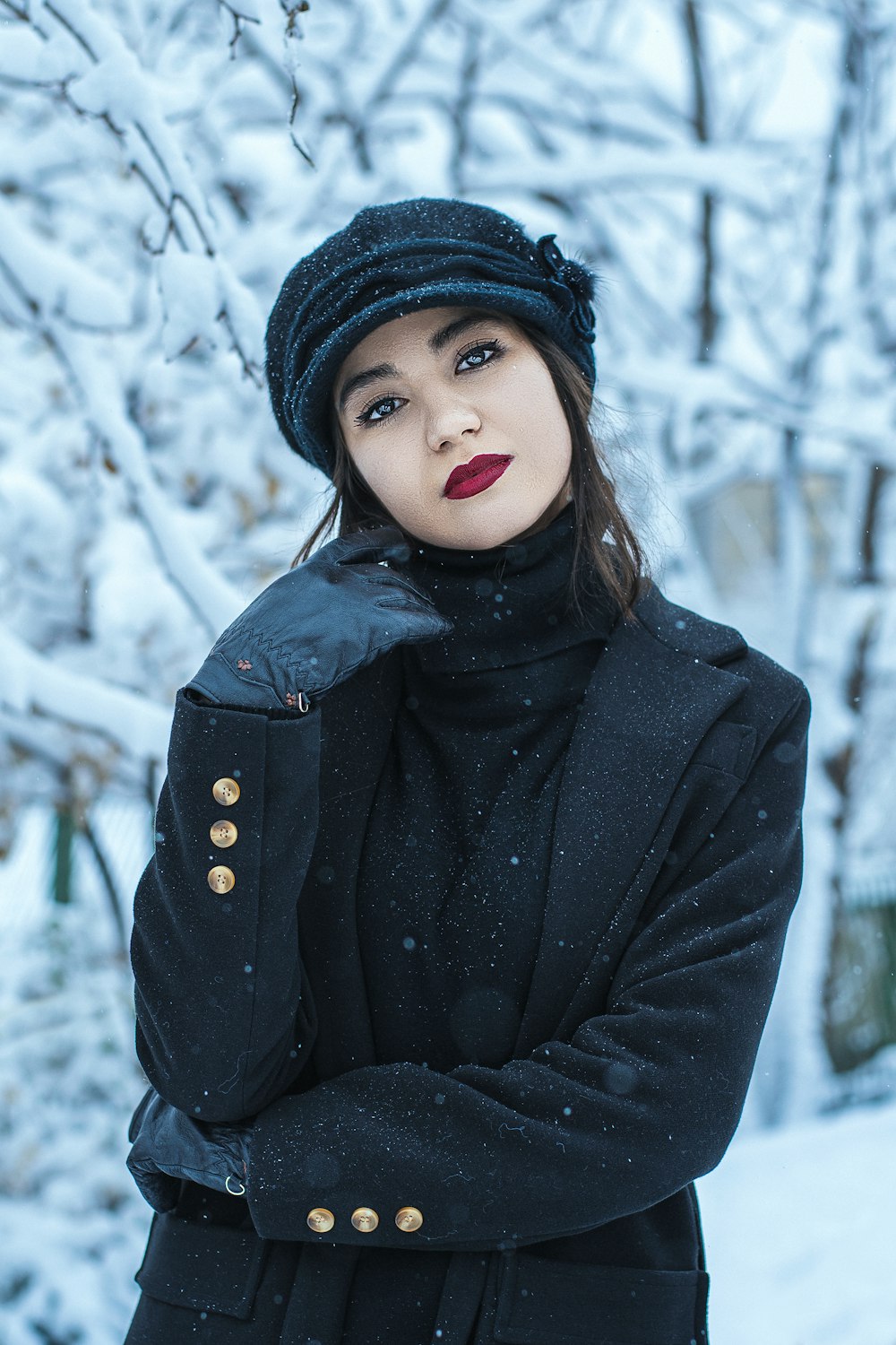 woman in black knit cap and black jacket