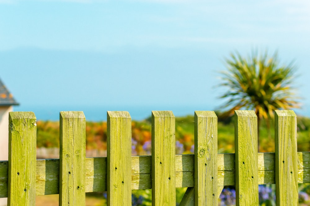 white wooden fence under white sky during daytime