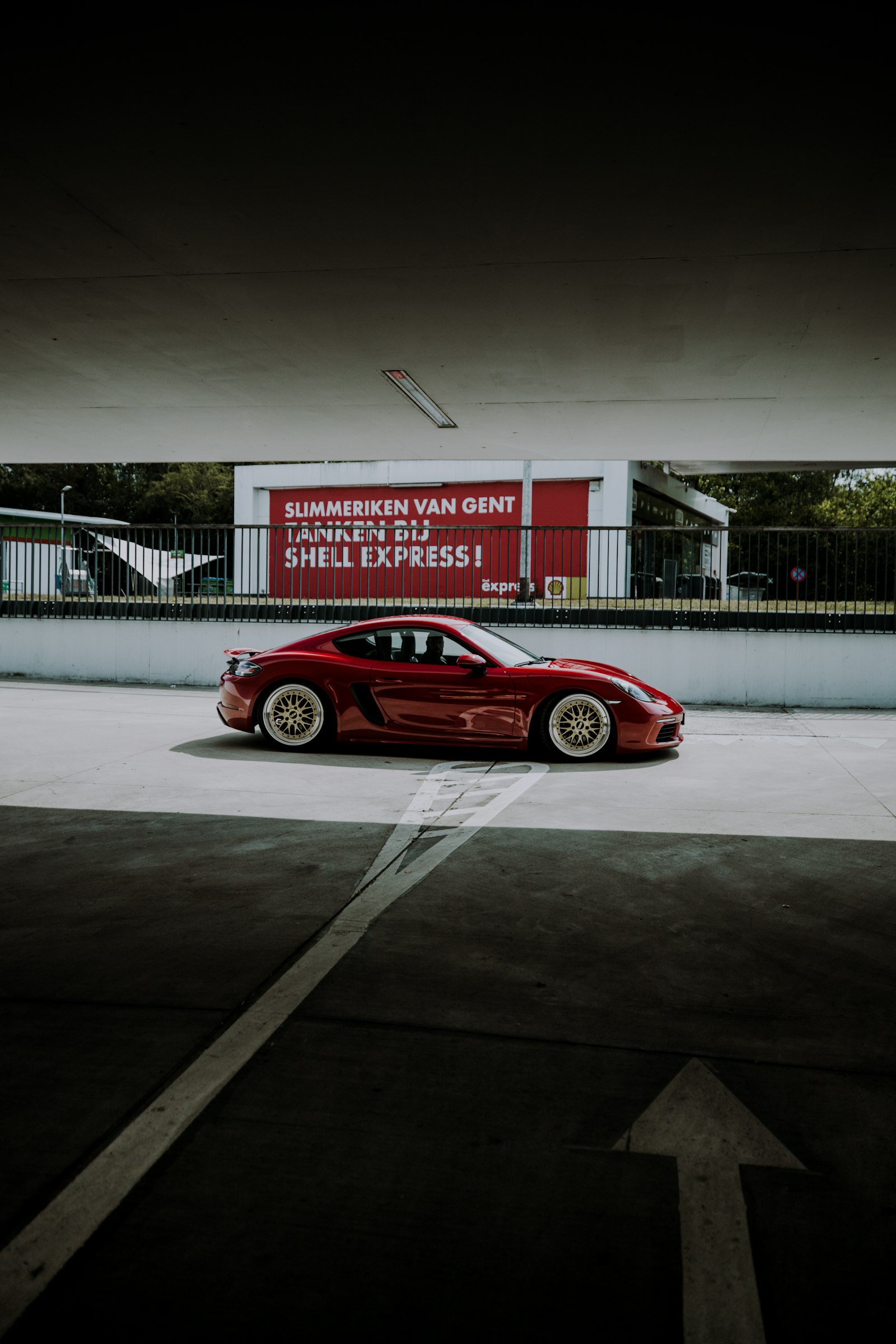 Canon EF 16-35mm F2.8L III USM sample photo. Red coupe parked on photography