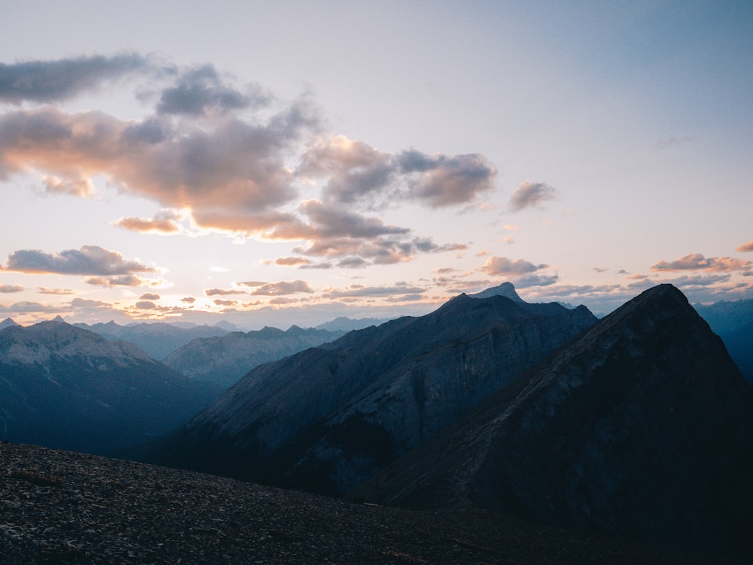 mountains under white clouds during daytime