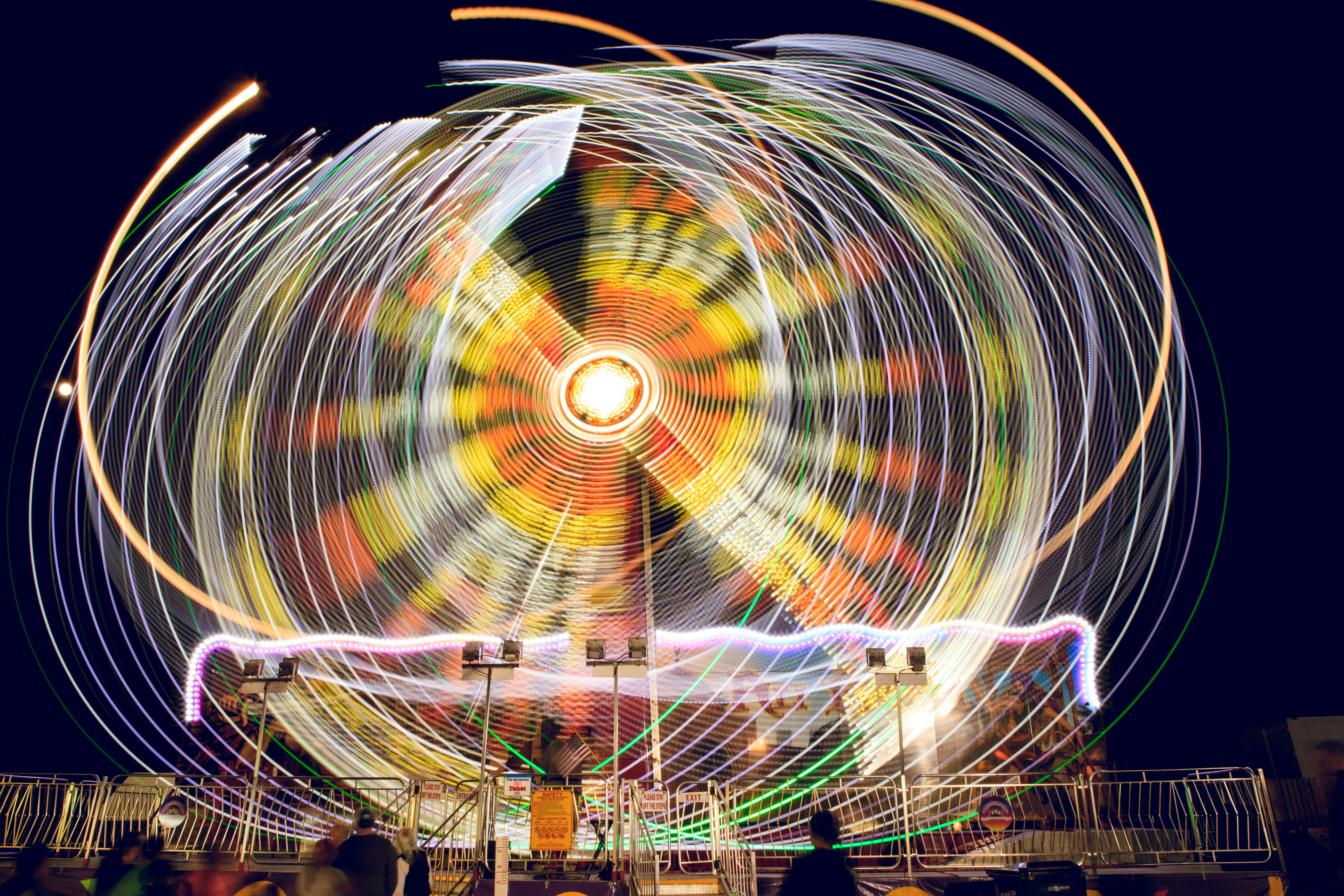 time lapse photography of ferris wheel during night time