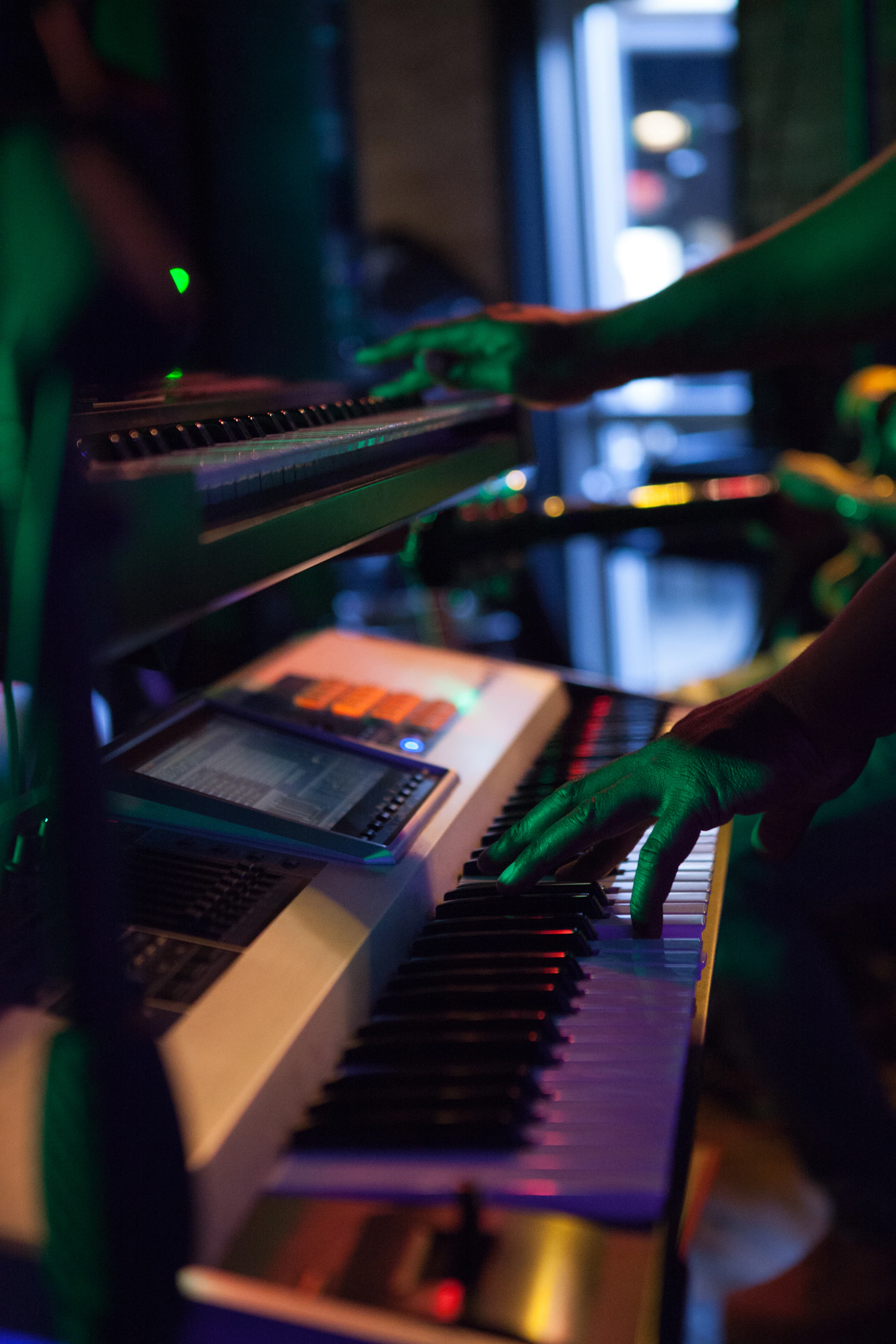 Hands on a piano keyboard