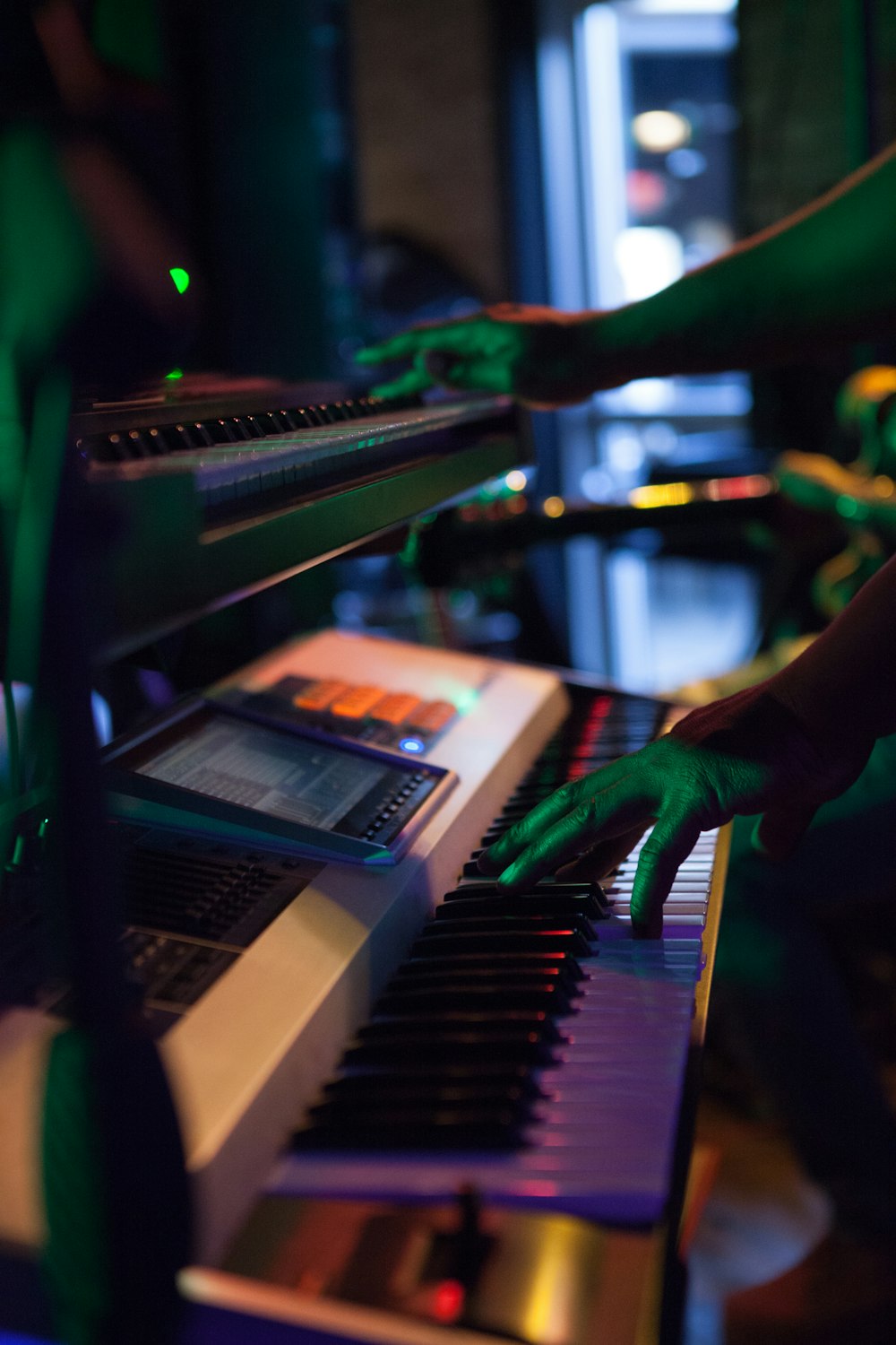 person playing piano in shallow focus lens