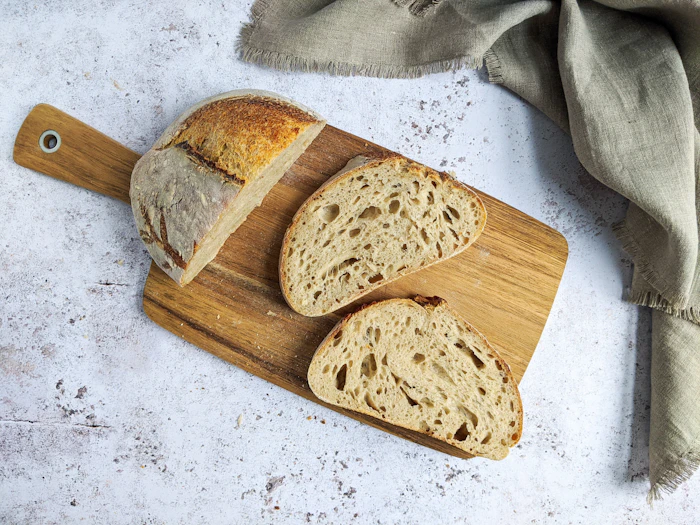 A crusty pain de campagne on a board