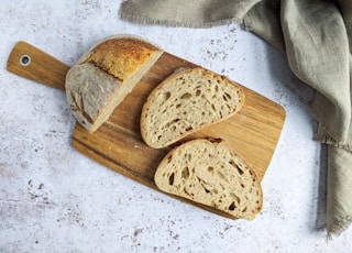 brown bread on brown wooden chopping board