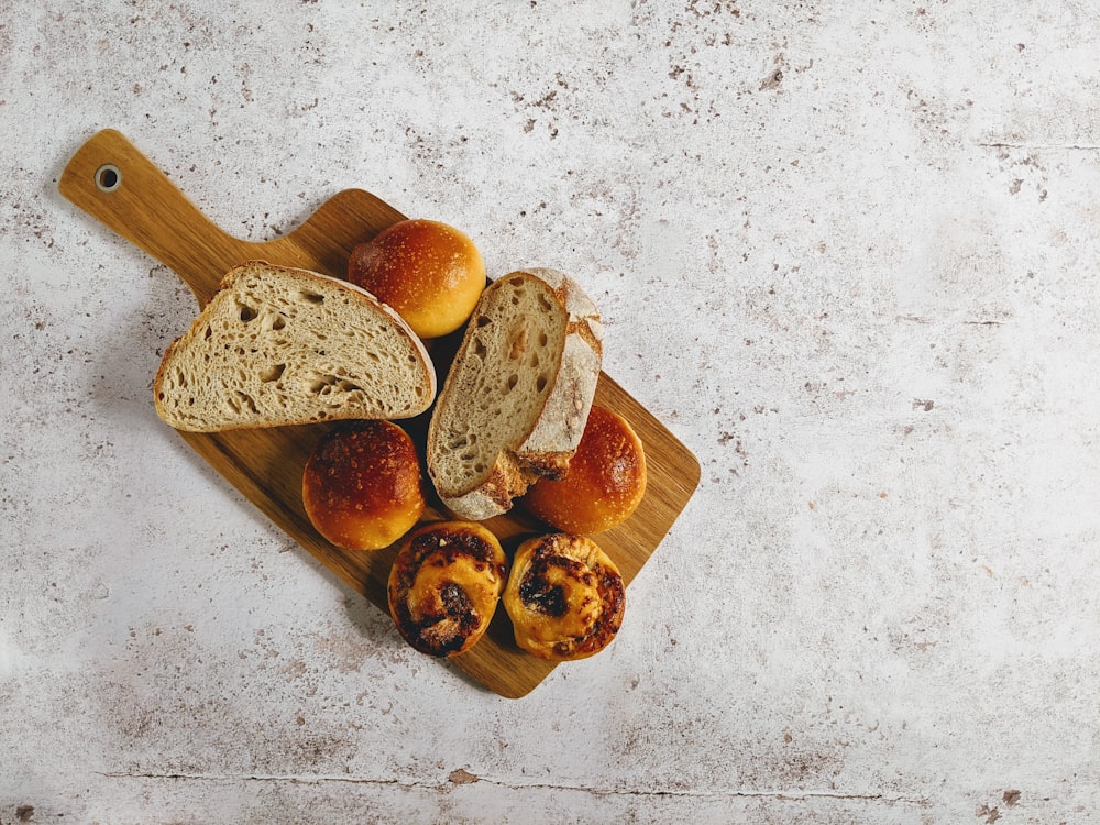 brown wooden chopping board with brown wooden spoon