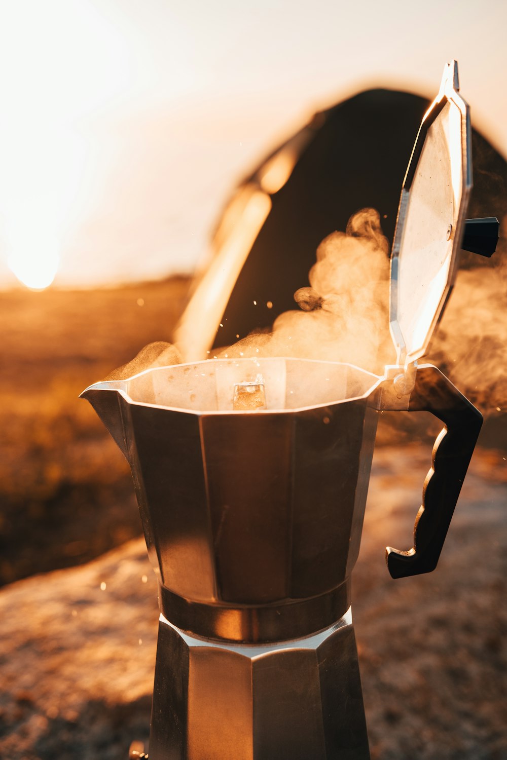 black coffee maker with white powder