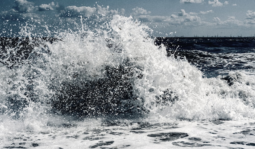 ocean waves under blue sky during daytime