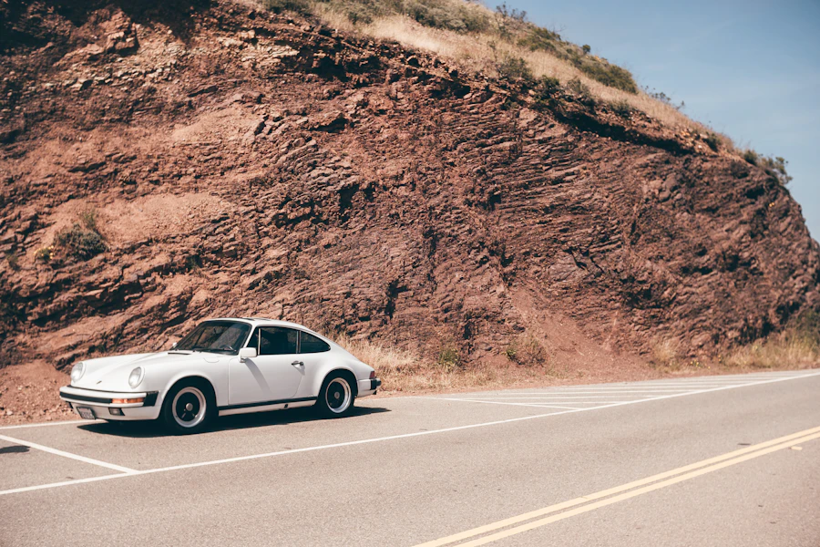 Classic silver Porsche on an open road