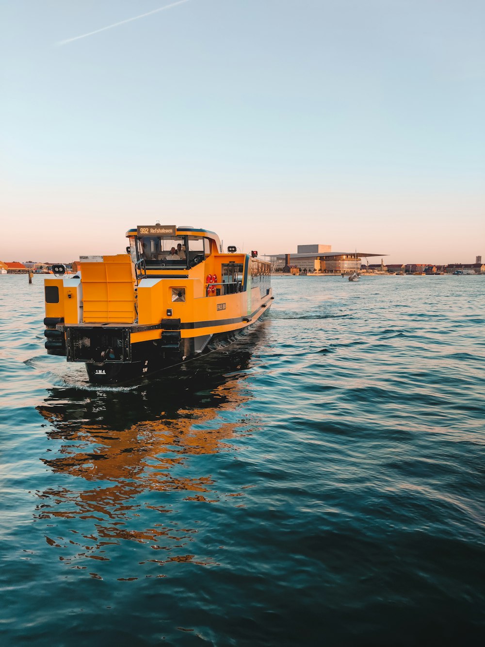 yellow and black boat on sea during daytime