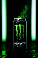 A vibrant close-up of a Long Jump energy drink can with dynamic splash effects.