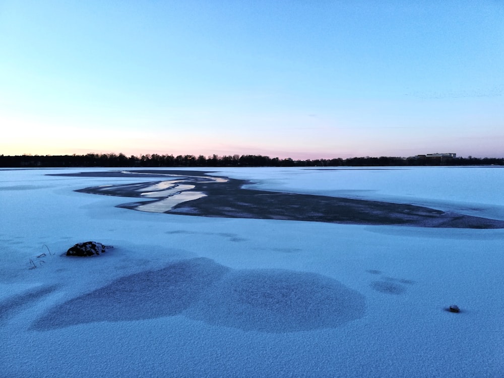 body of water under blue sky during daytime