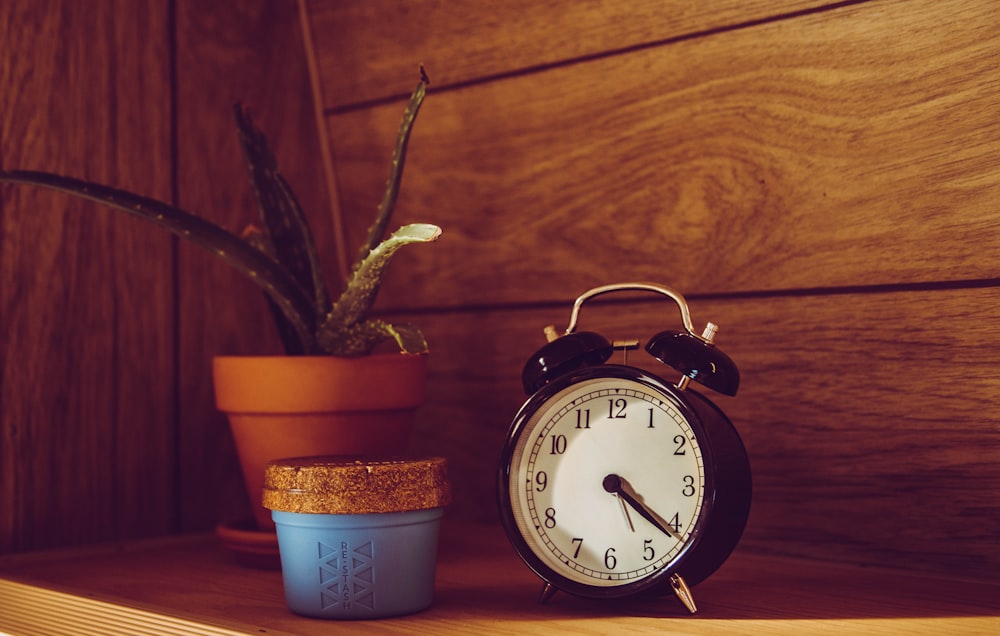 white and brown alarm clock at 10 00