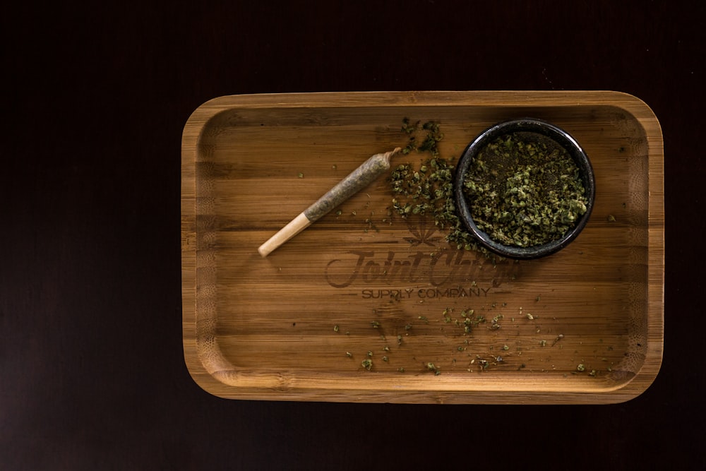 green plant on brown wooden tray