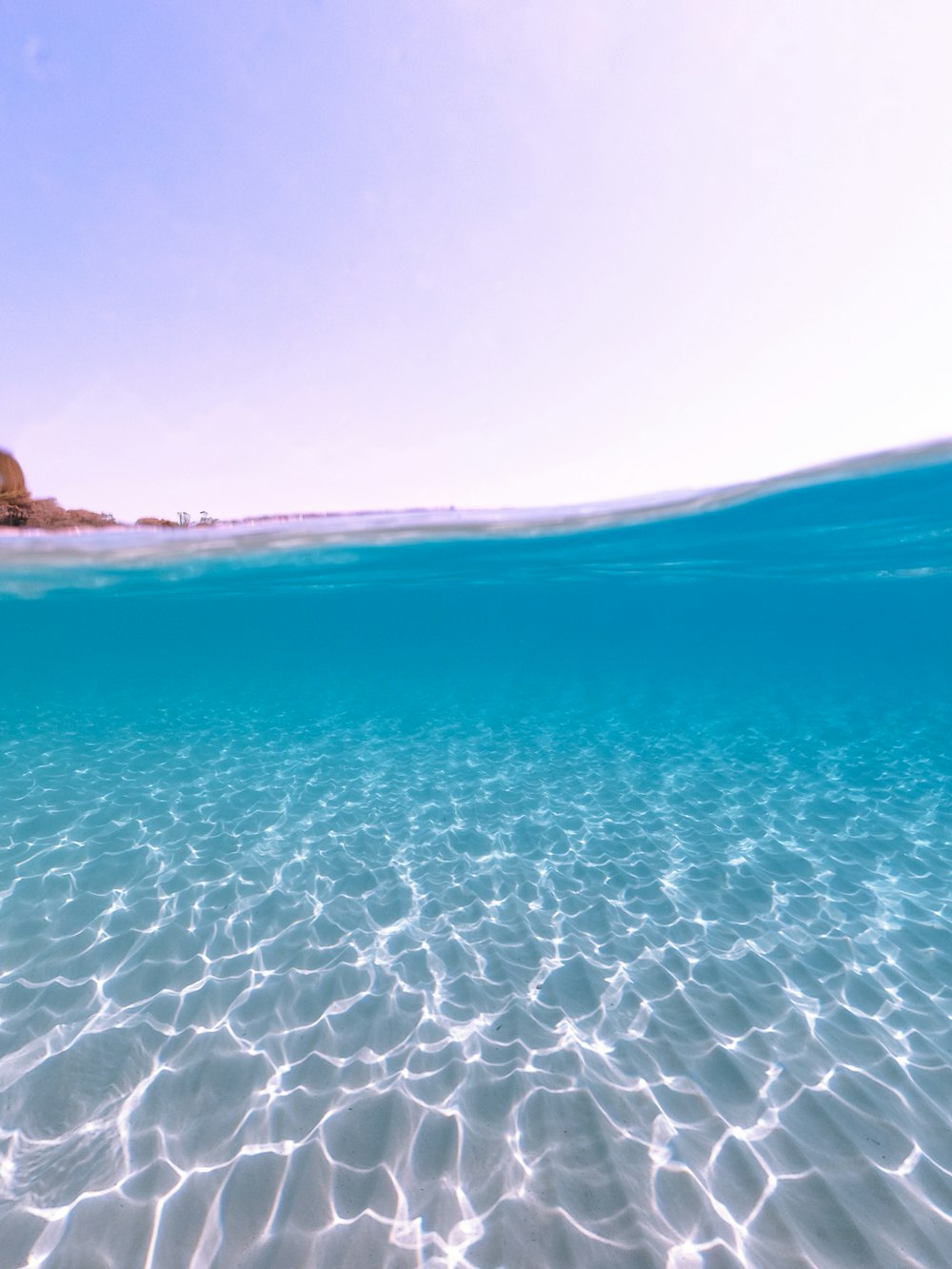 blue sea under blue sky during daytime