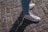 A happy customer wearing royal path footwear.