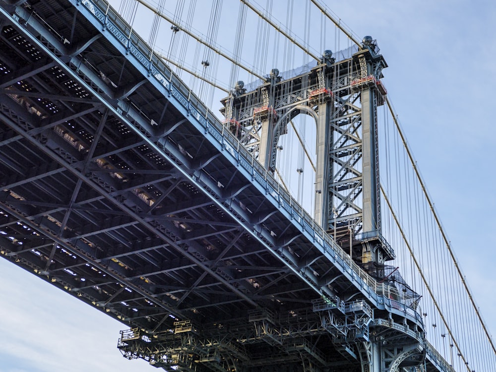 gray metal bridge under white sky during daytime