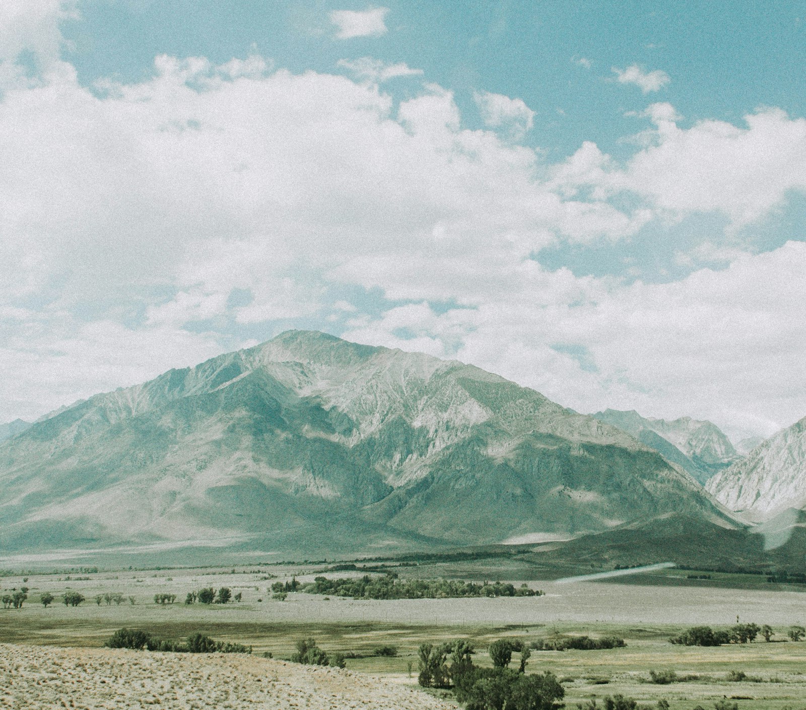 Canon EOS 60D + Canon EF 28-135mm F3.5-5.6 IS USM sample photo. Green and white mountains photography