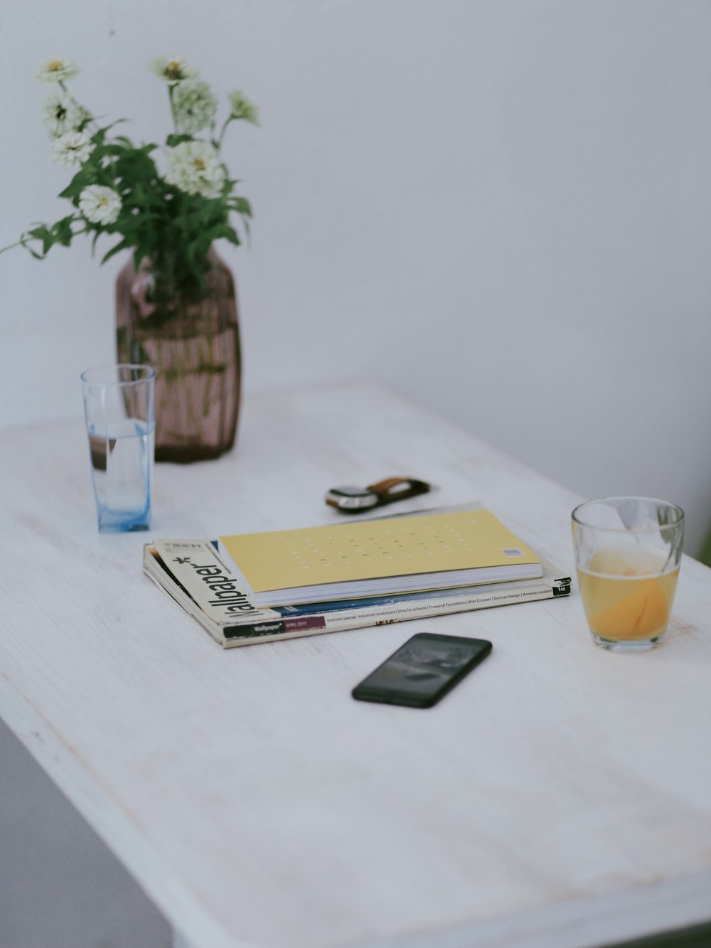 black smartphone on white table