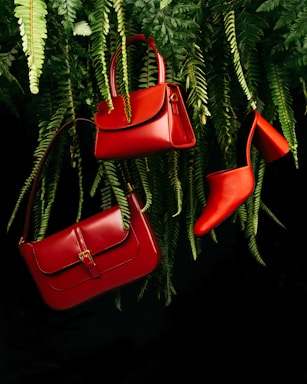 fashion photography,how to photograph red leather handbag on green pine tree