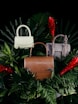 brown leather handbag on green pine tree