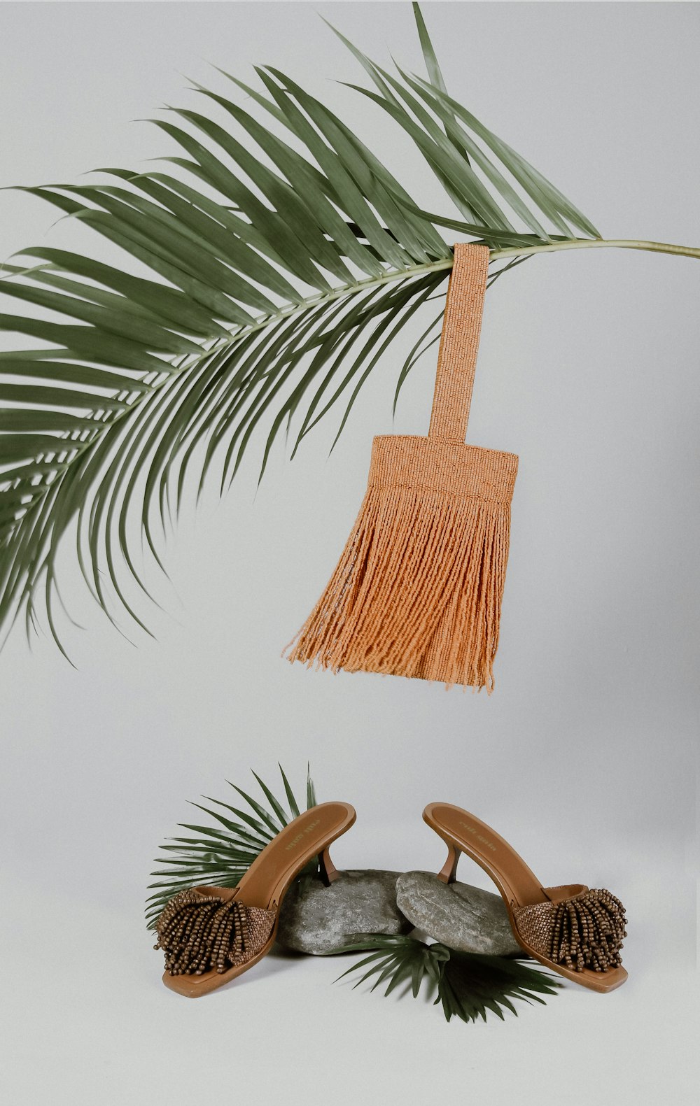 brown wooden chair near green palm tree